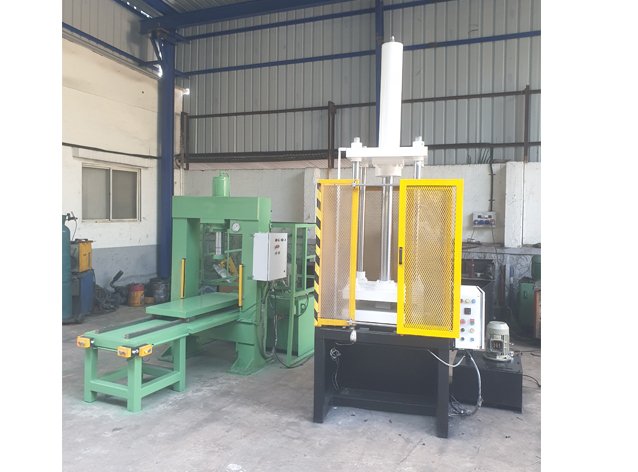 Four-Pillar Hydraulic Press with feed conveyor table, built by Desire Hydraulics, Pune