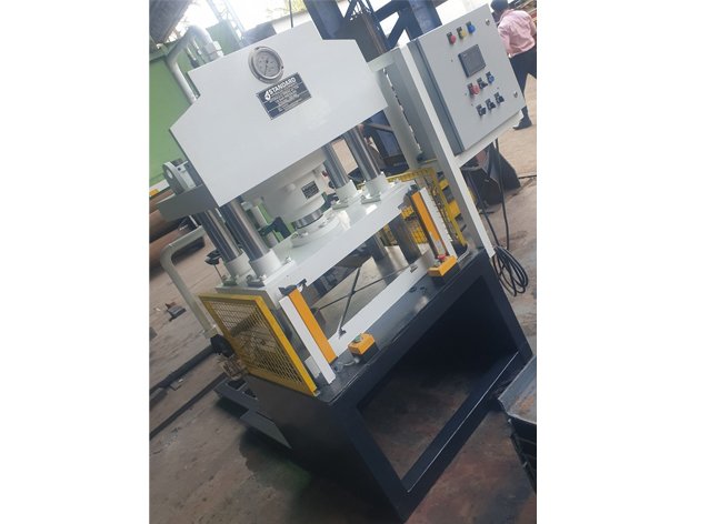 Operator running a Four-Pillar Hydraulic Press with PLC control panel, Pune facility