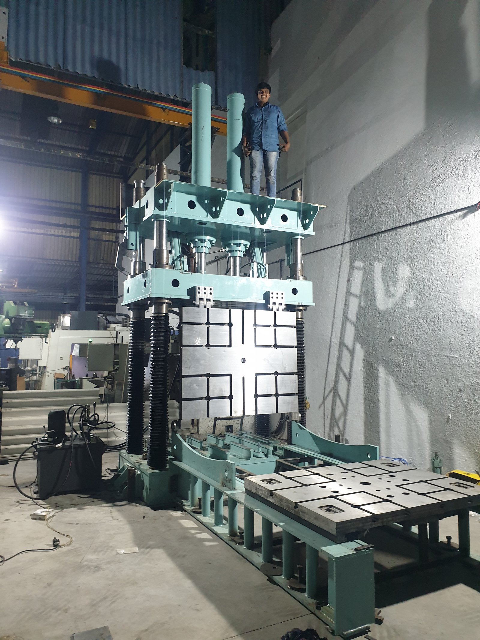 Heavy-duty Four-Pillar Hydraulic Press with bellows-covered columns, manufactured in Maharashtra
