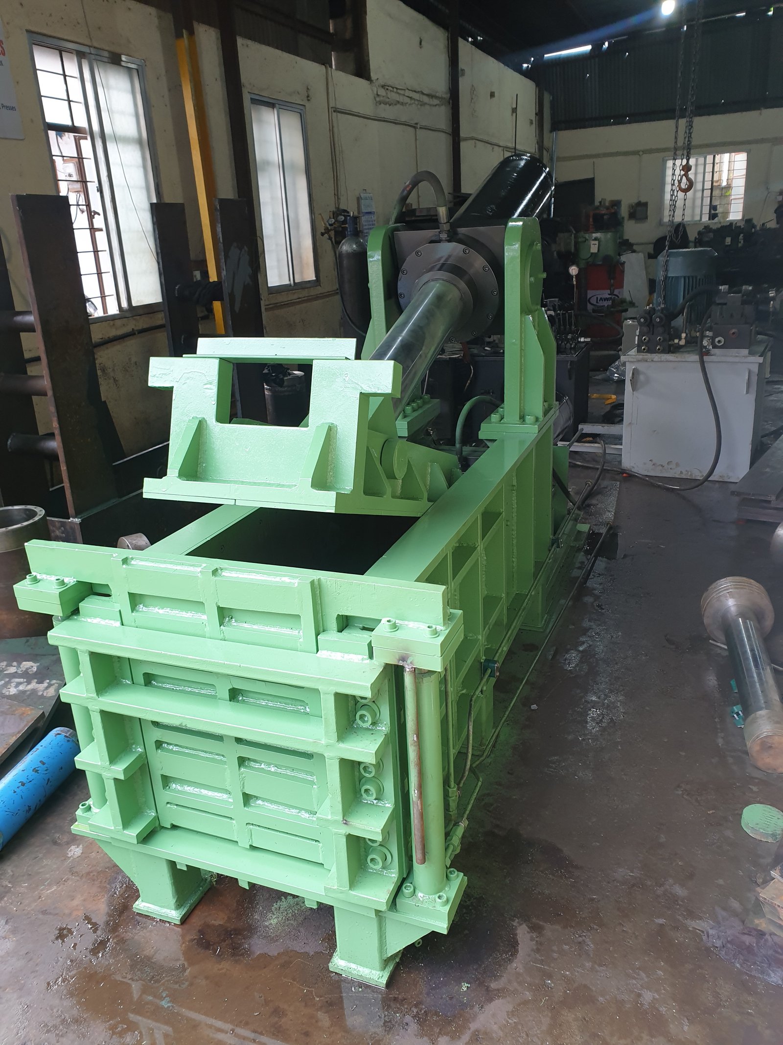 Green Hydraulic Baler Machine for scrap metal, manufactured by Desire Hydraulics, Pune
