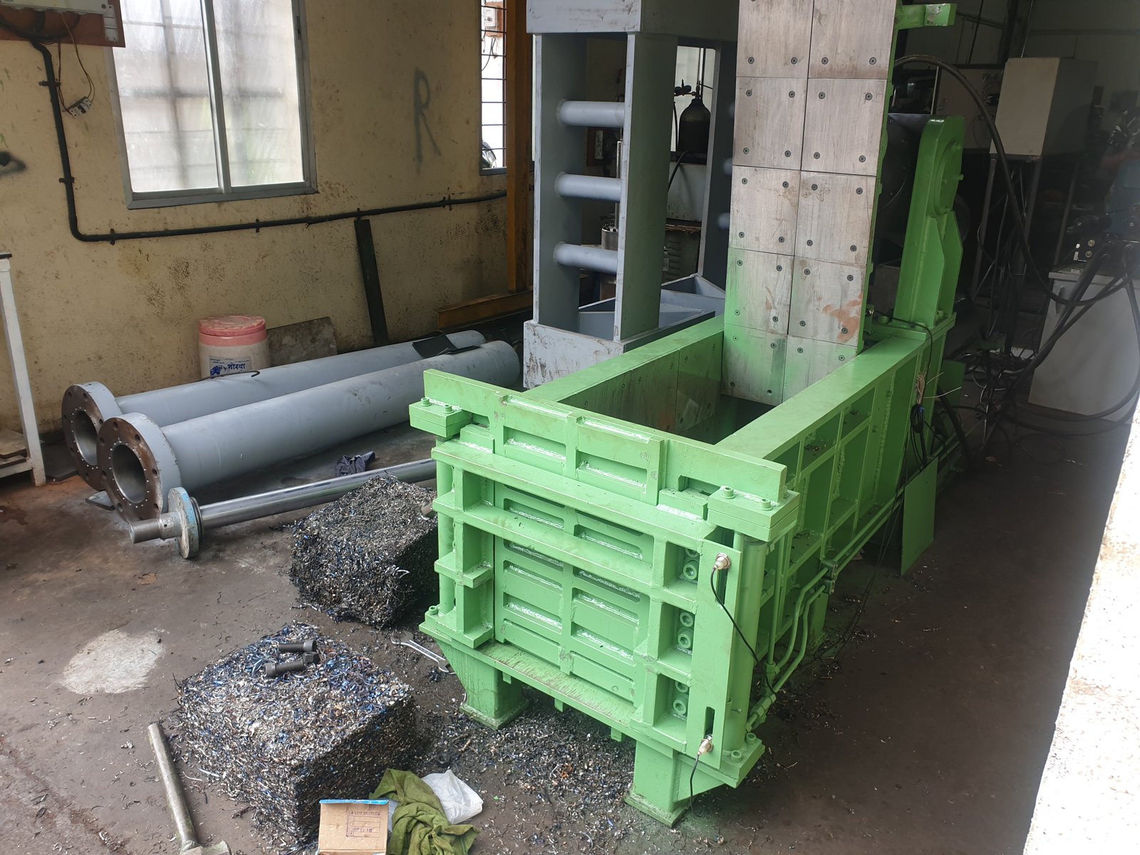 Hydraulic Baler compaction chamber with wear plates and finished scrap bales, Desire Hydraulics Pune
