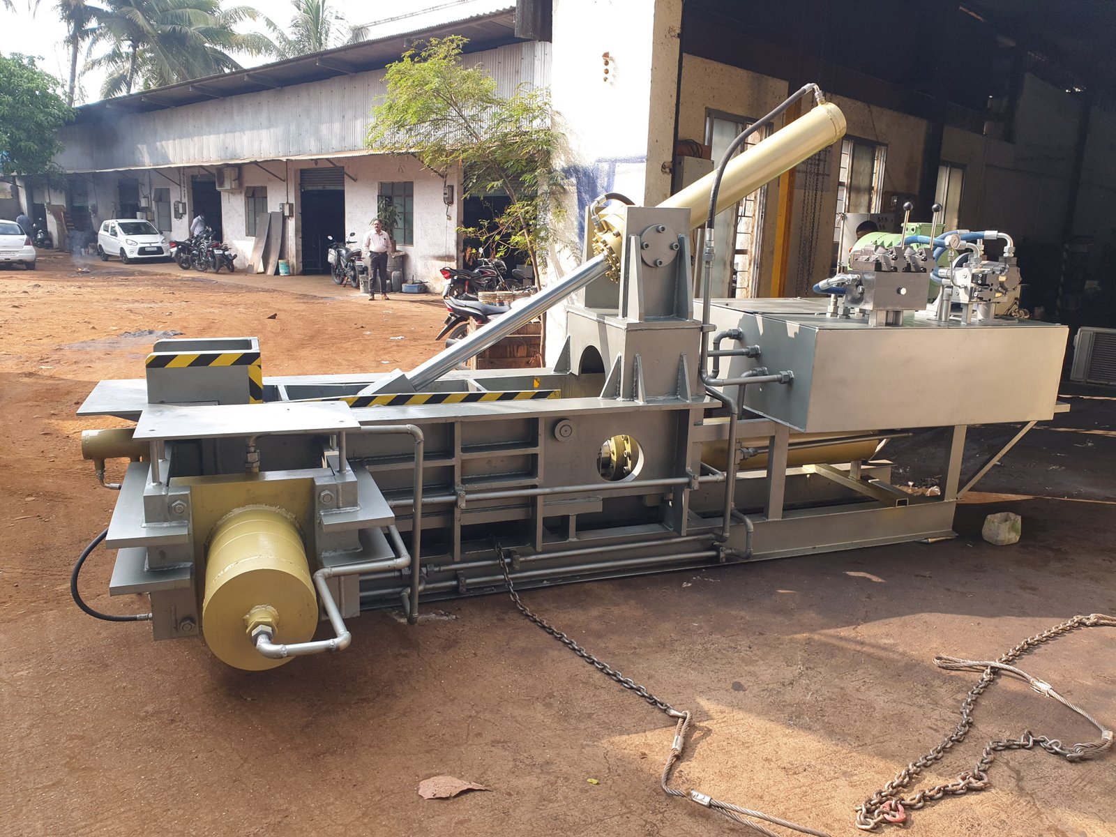 Large Hydraulic Baler Machine ready for dispatch with rigging chains, Desire Hydraulics Pune
