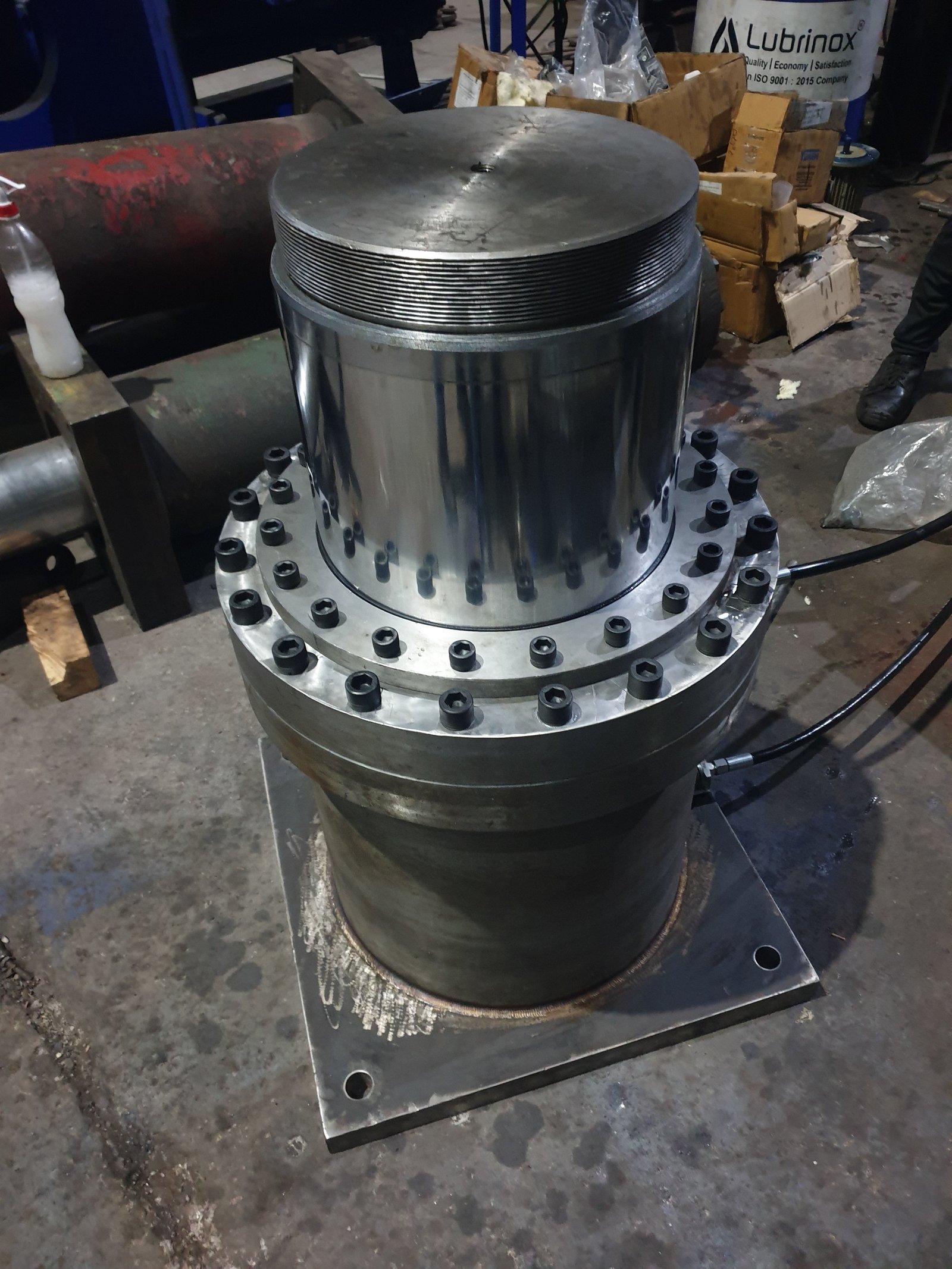 Close-up of a large flanged Hydraulic Cylinder with bolted end cap, manufactured by Desire Hydraulics, Pune