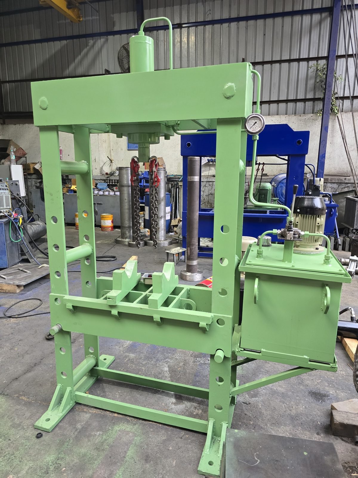 Green H-Frame Hydraulic Workshop Press with chain hoist, manufactured in Pune