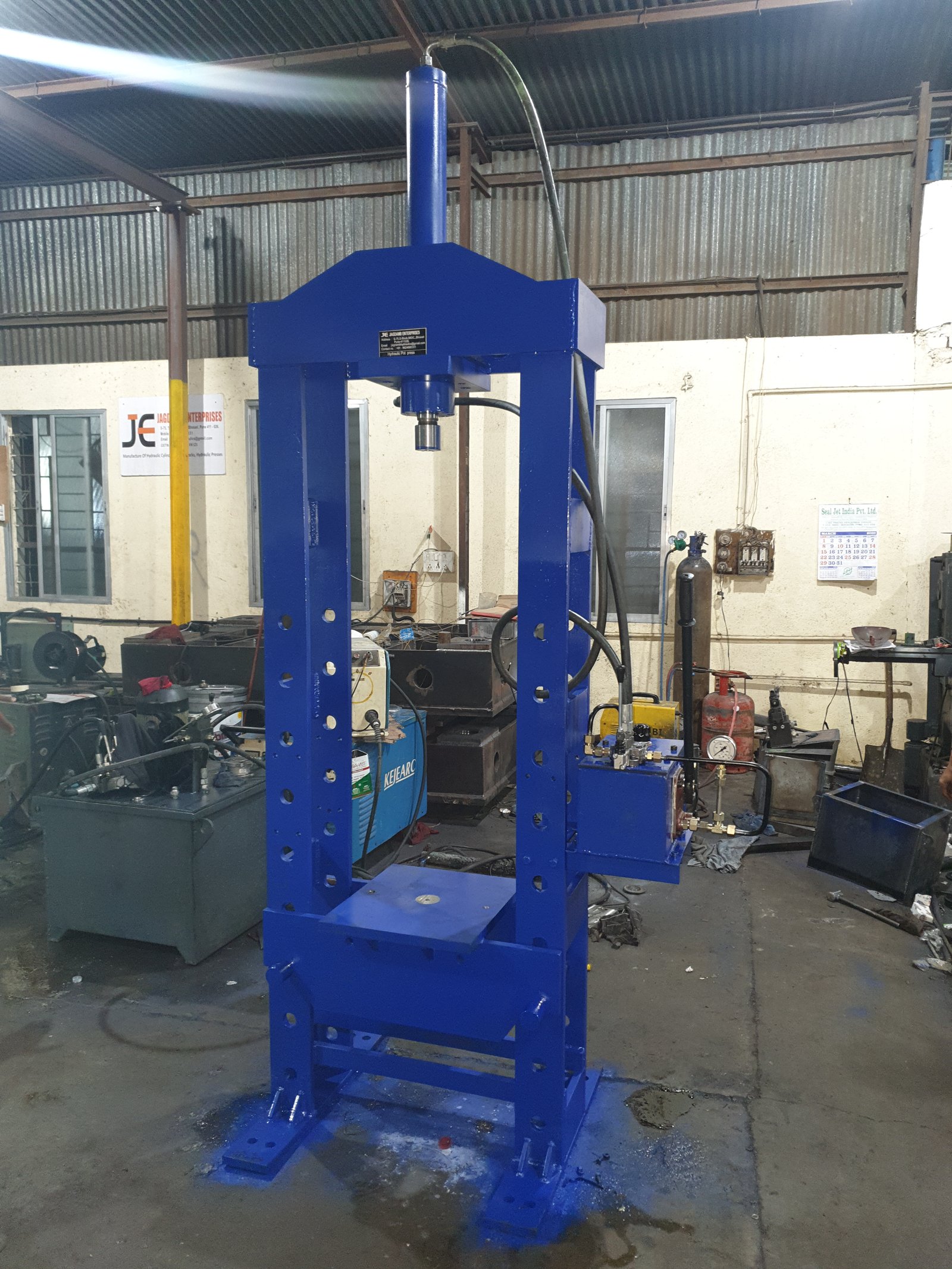 Blue H-Frame Hydraulic Workshop Press with multi-hole columns, manufactured by Desire Hydraulics, Pune