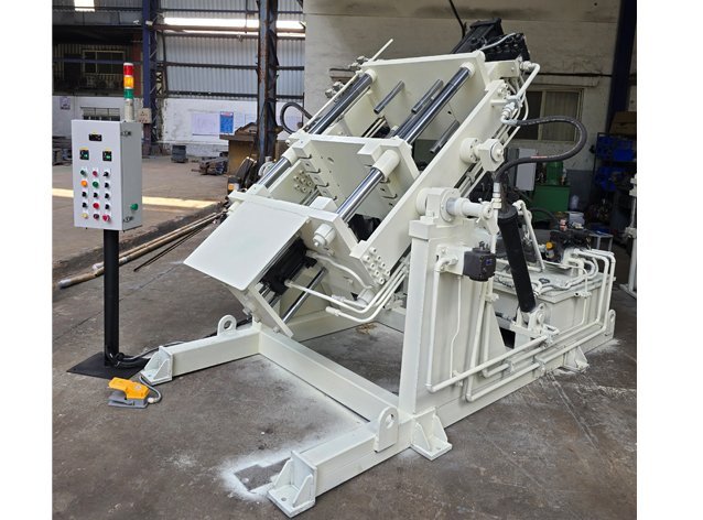 GDC tilting machine shown in the tilted pouring position with hydraulic cylinders and die mount, ready for dispatch