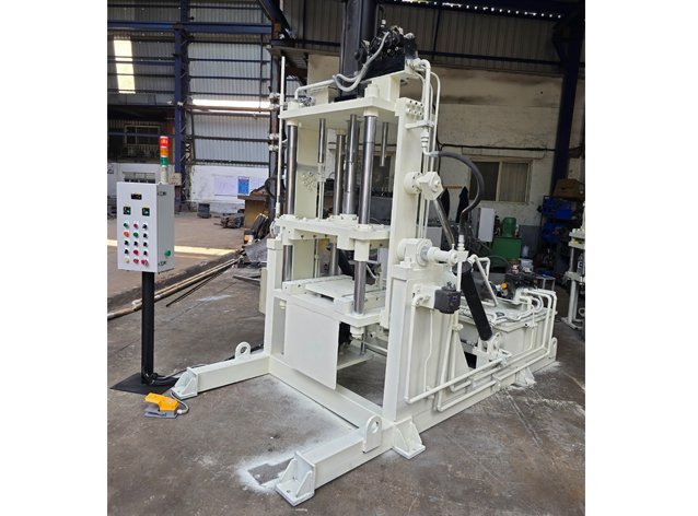 Vertical Gravity Die Casting machine with hydraulic clamping cylinders and powder-coated frame before dispatch
