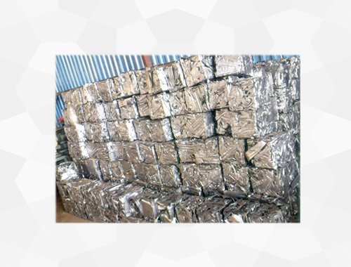 Metal punching scrap compressed into dense bales by a Hydraulic Baler from Desire Hydraulics